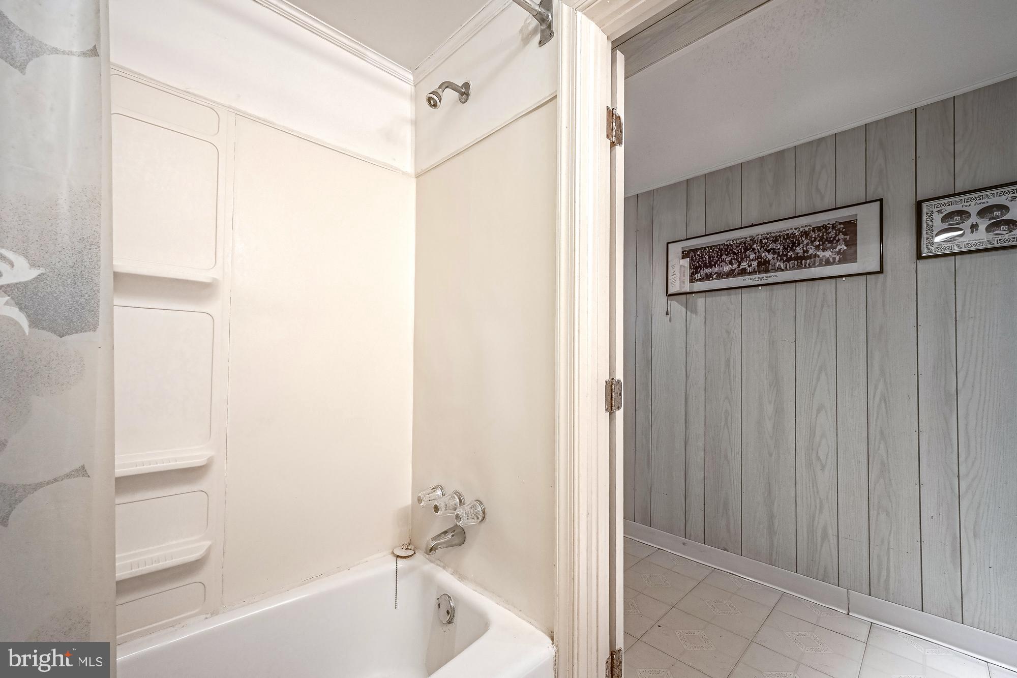 2947 Random Road Falls Church, VA 22042 - Photo 20 of 26 a bathroom with a bathtub and a shower