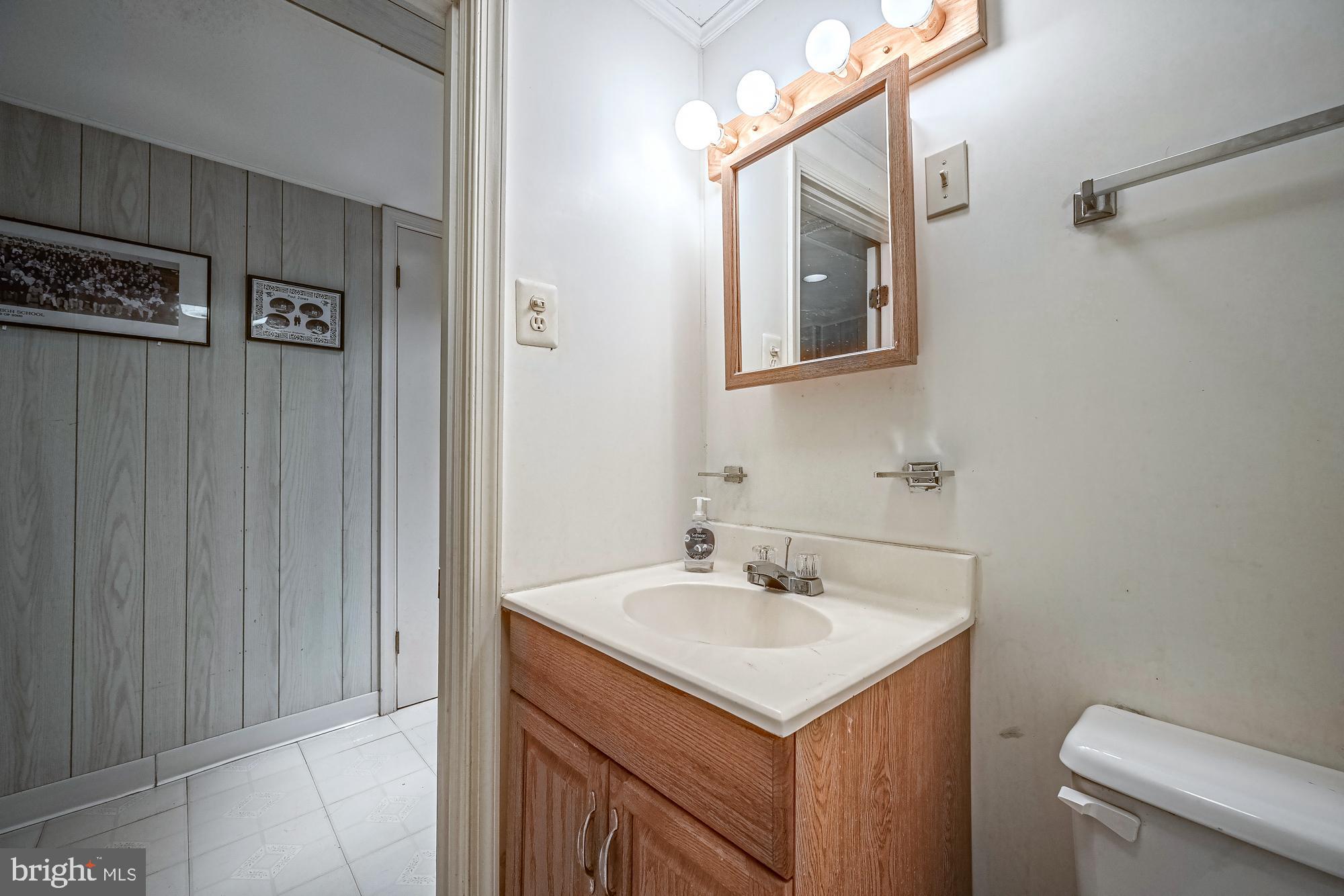 2947 Random Road Falls Church, VA 22042 - Photo 21 of 26 a bathroom with a sink toilet and mirror