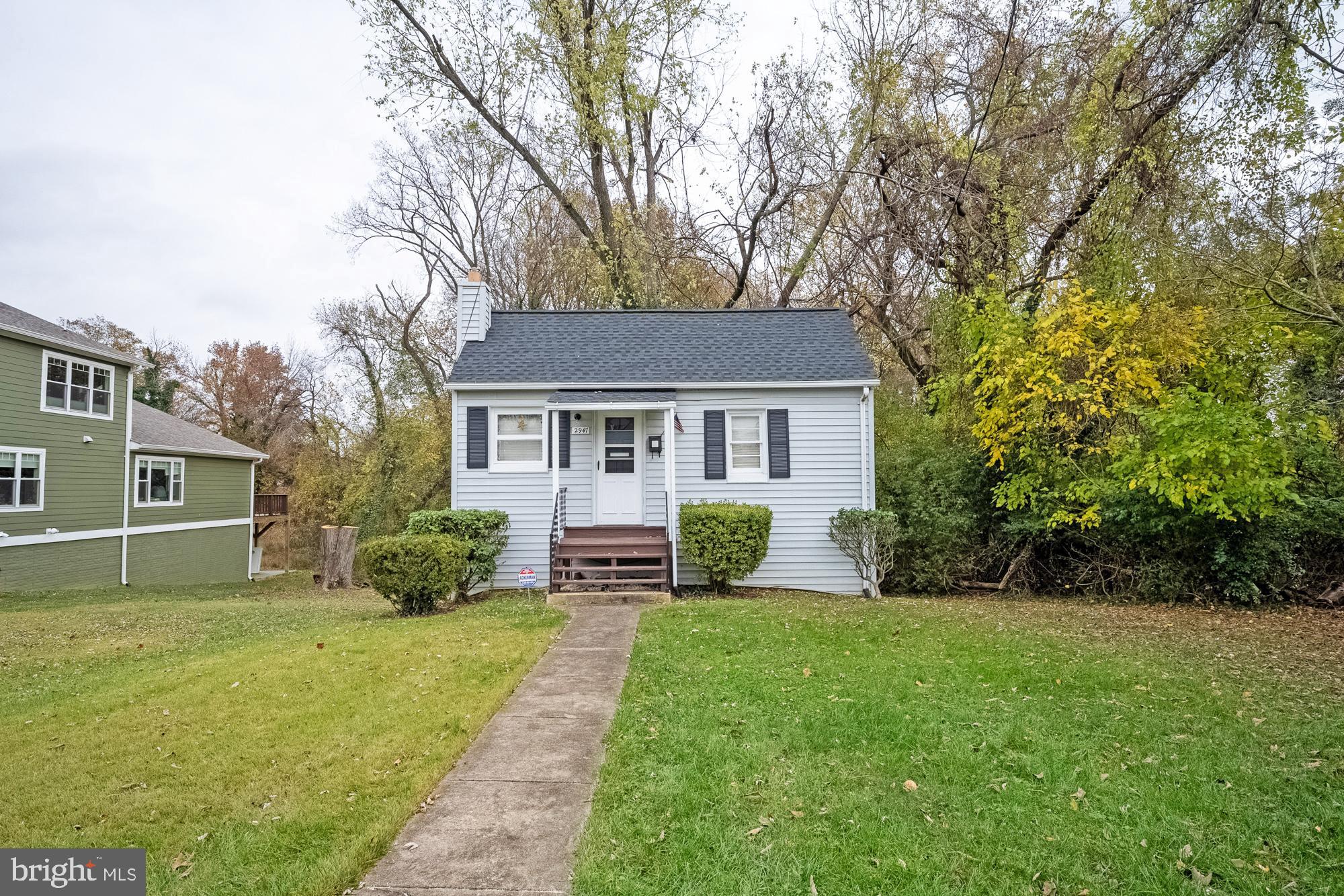 2947 Random Road Falls Church, VA 22042 - Photo 3 of 26 a front view of a house with yard and green space