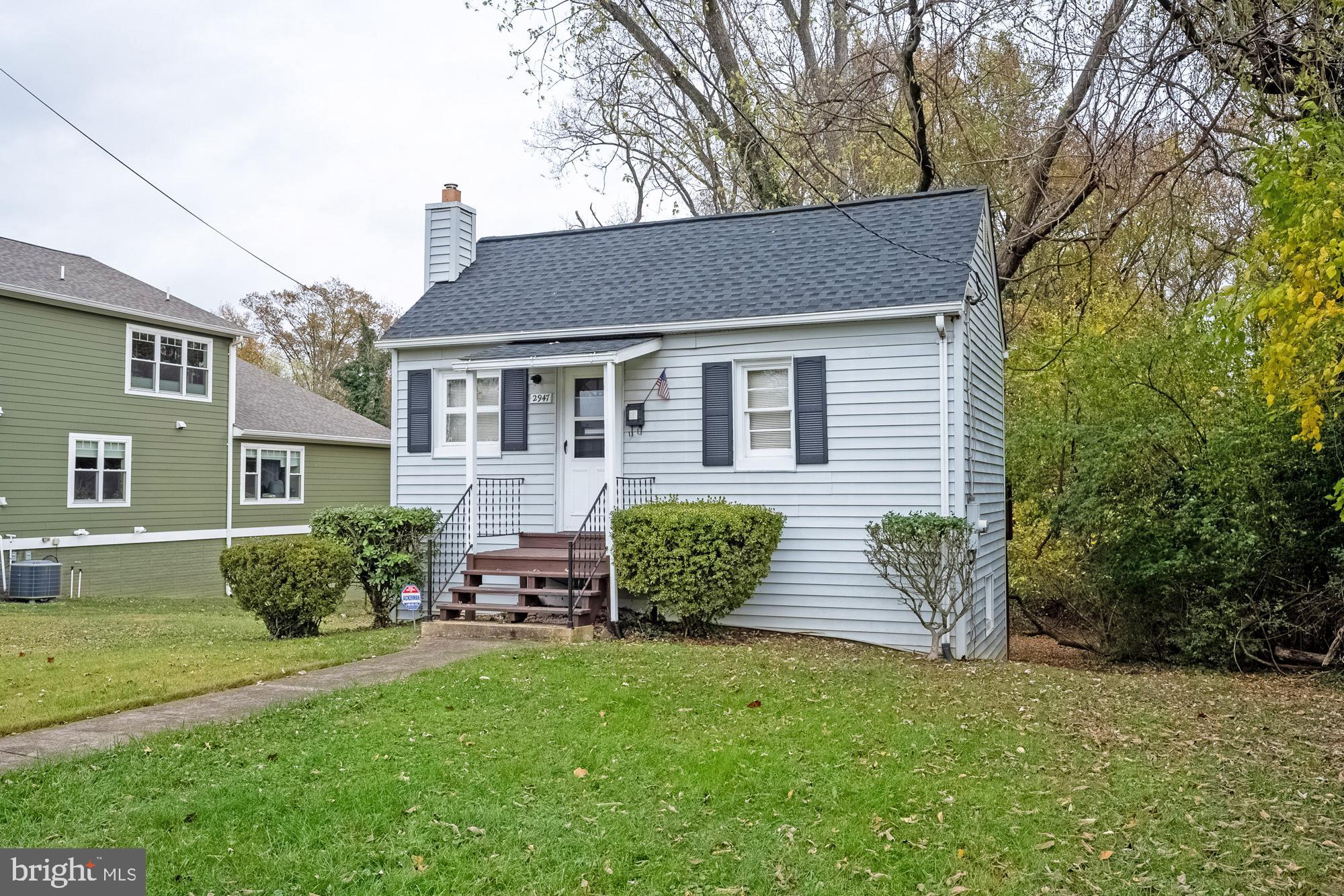 2947 Random Road Falls Church, VA 22042 - Photo 4 of 26 a front view of a house with a garden
