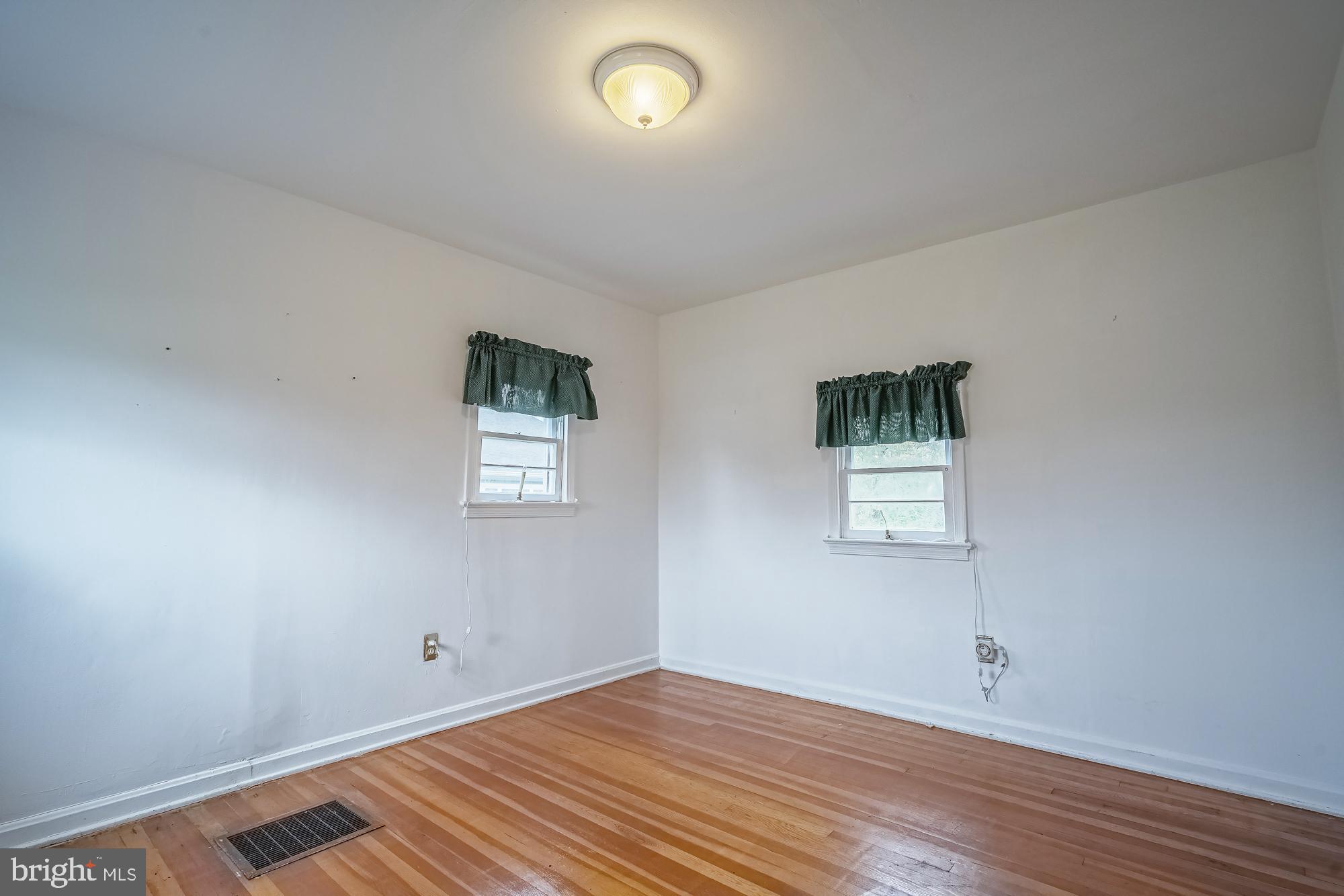 2947 Random Road Falls Church, VA 22042 - Photo 8 of 26 an empty room with wooden floor and windows