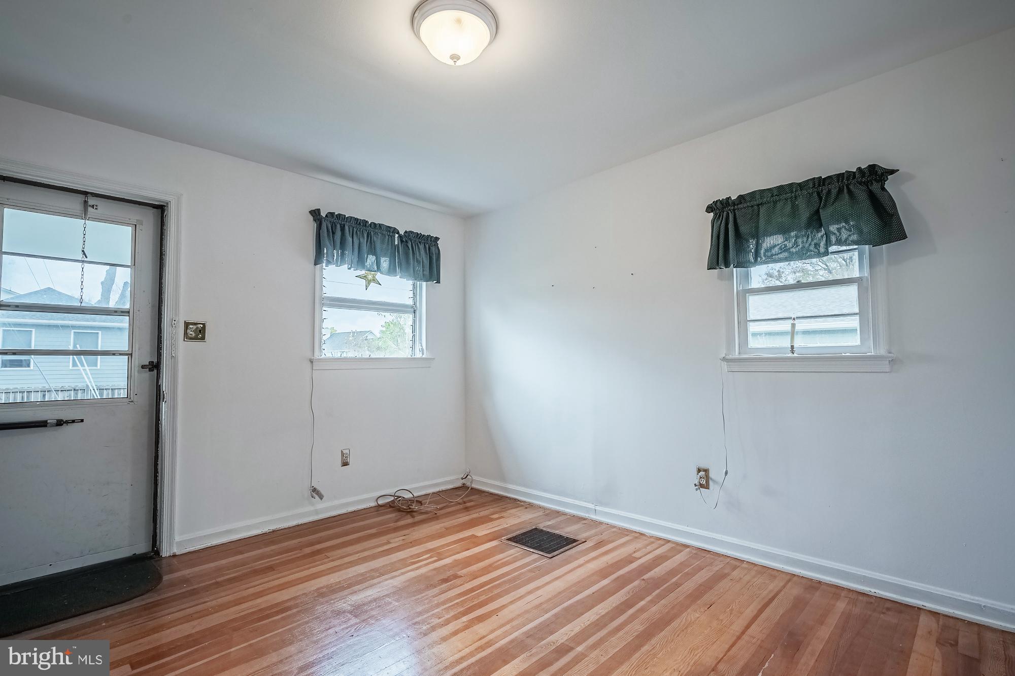 2947 Random Road Falls Church, VA 22042 - Photo 9 of 26 an empty room with wooden floor and windows