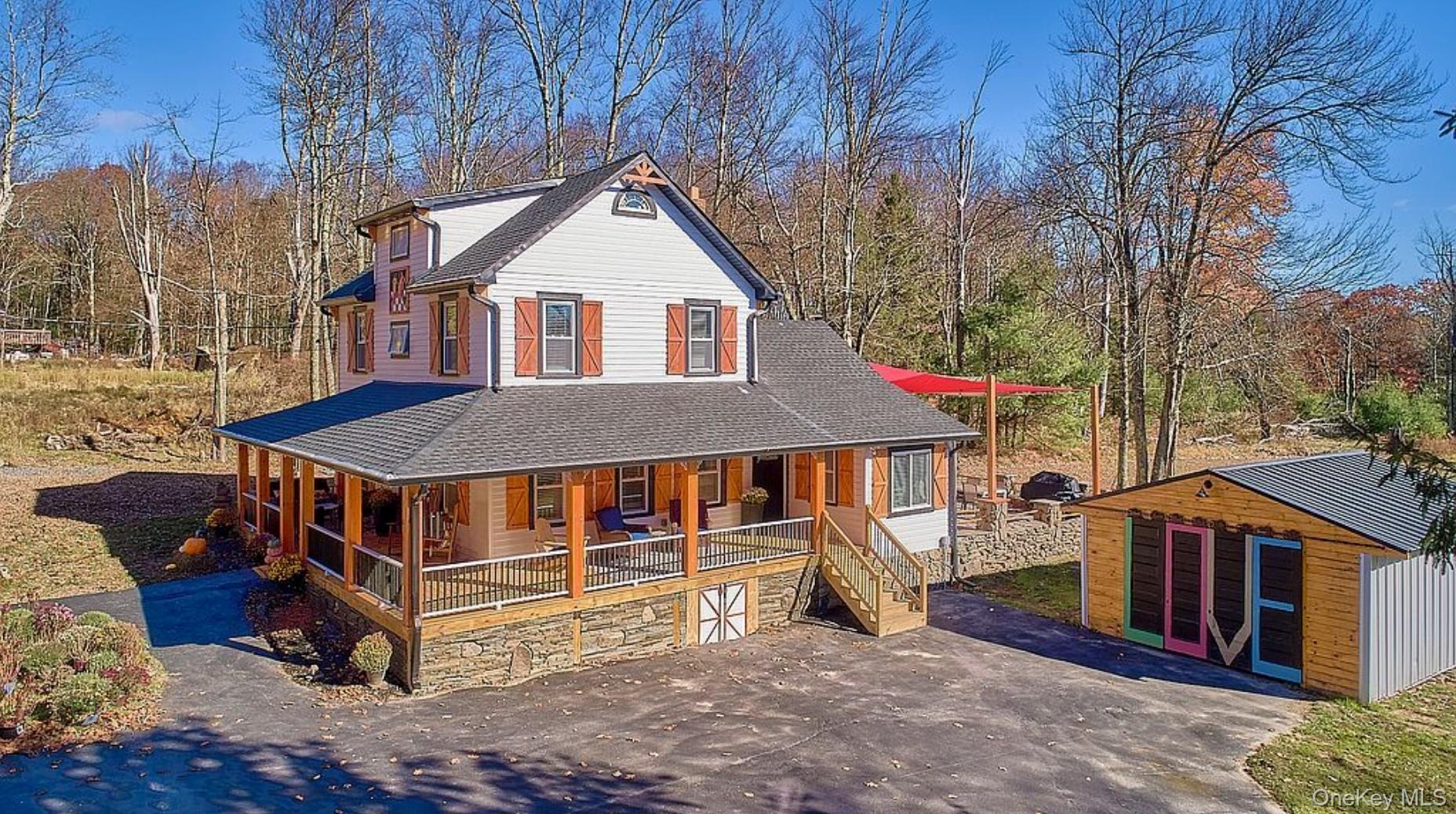 541 Cold Spring Road Monticello, NY 12701 - Photo 2 of 31 a front view of a house with a yard