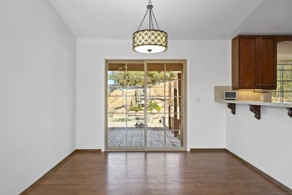 a kitchen with a stove a sink and a window