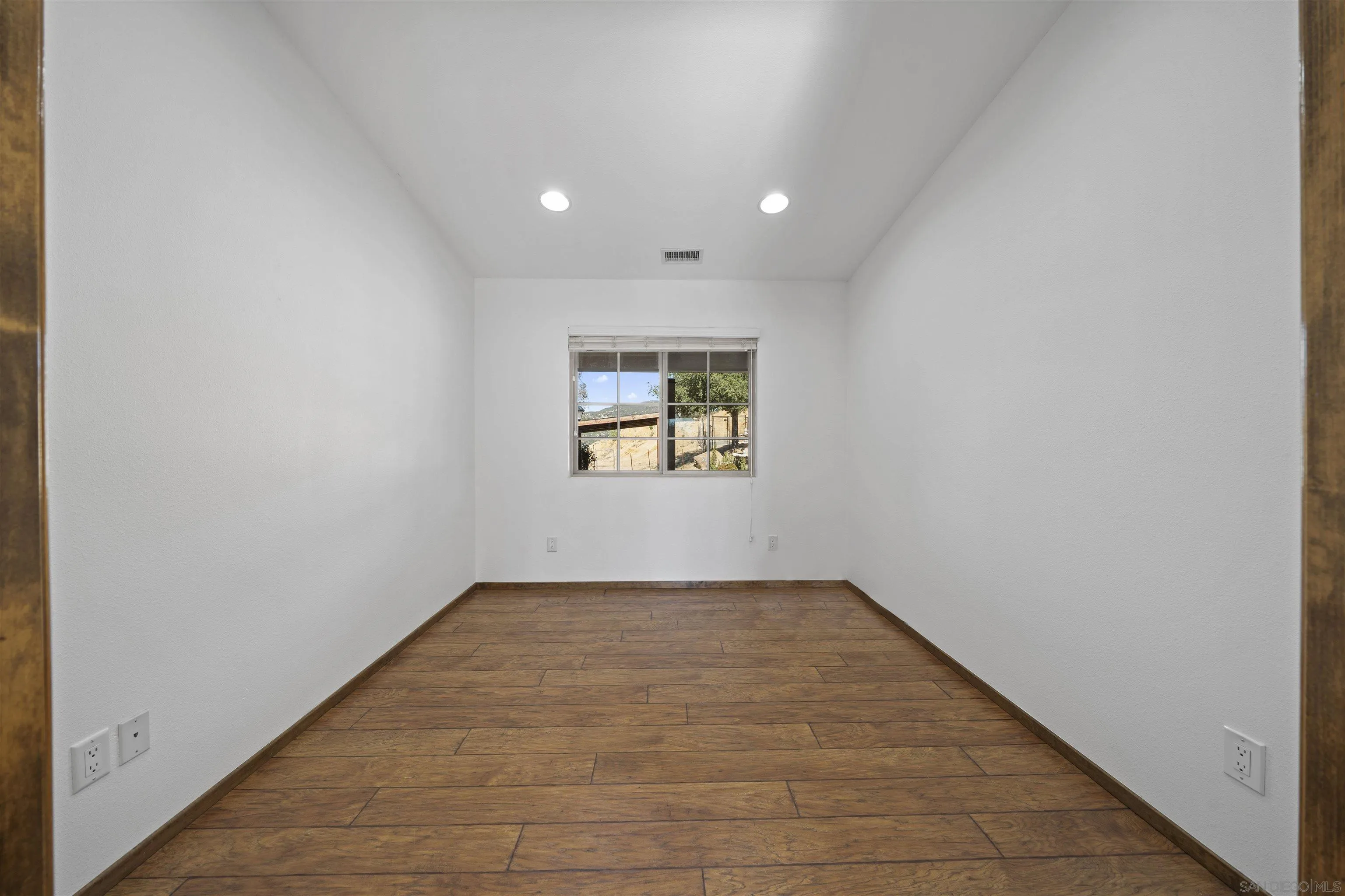 20872 Deerhorn Valley Road Jamul, CA 91935 - Photo 20 of 64 an empty room with windows