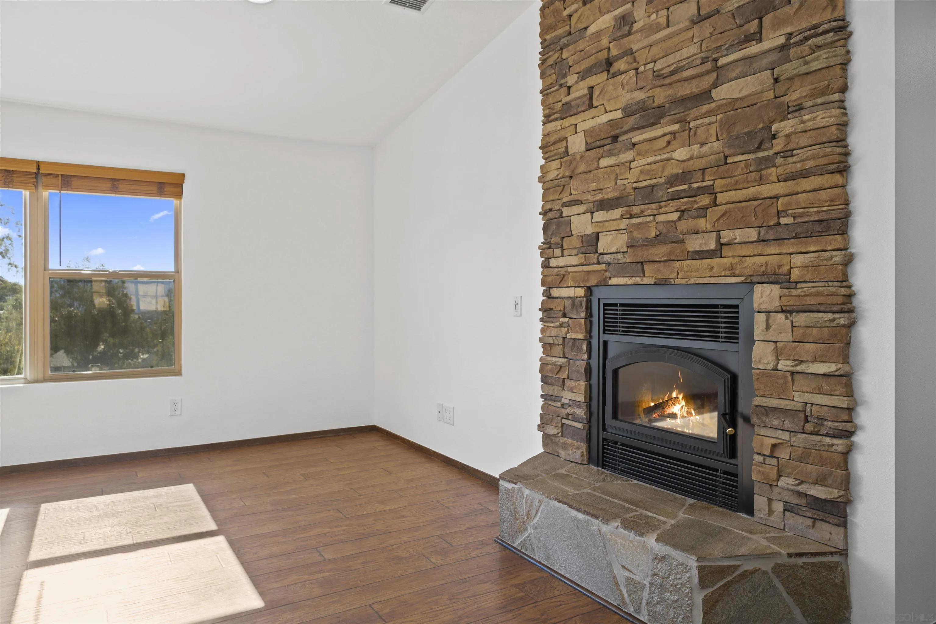 20872 Deerhorn Valley Road Jamul, CA 91935 - Photo 21 of 64 a living room with a fireplace