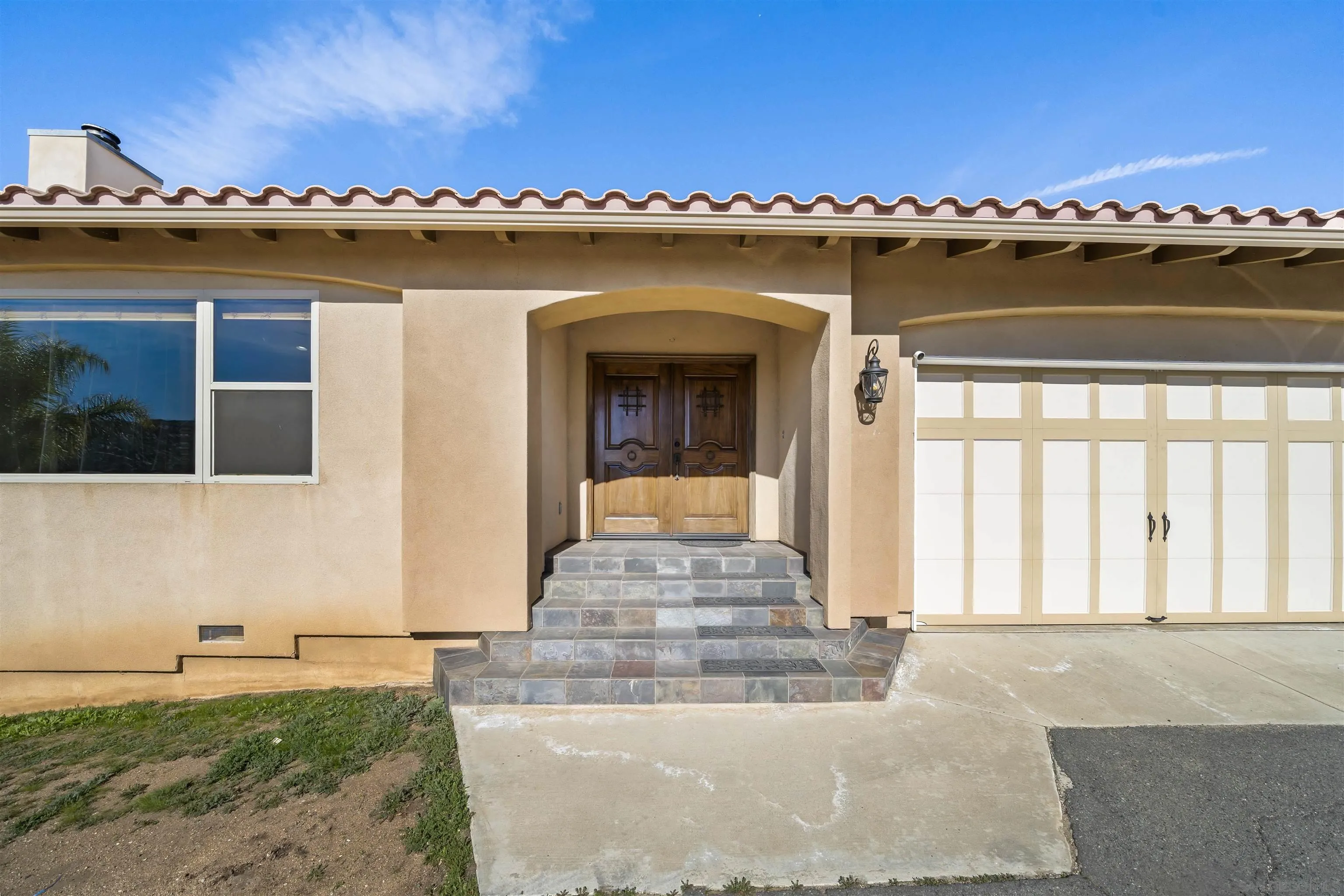 20872 Deerhorn Valley Road Jamul, CA 91935 - Photo 3 of 64 a view of a house with a balcony