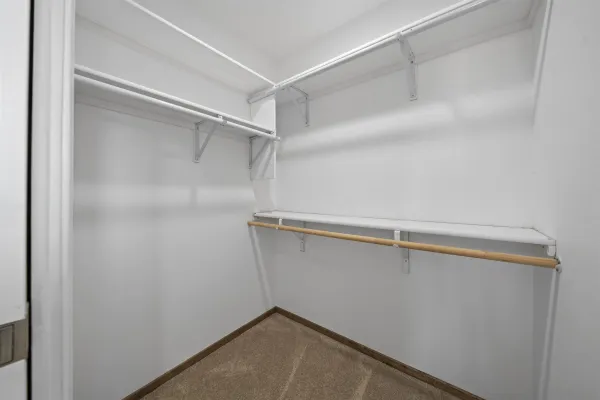 a view of a white house with a yard