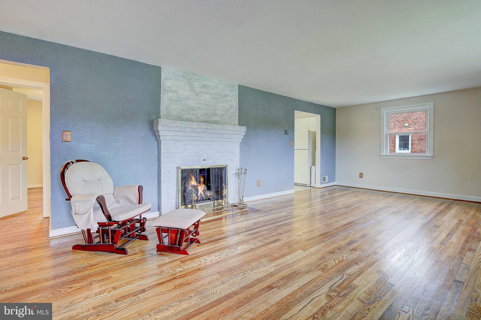 7719 Woodyard Road Clinton, MD 20735 - Photo 14 of 23 Living room with fireplace