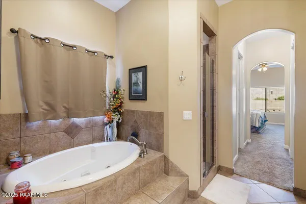 a bathroom with a tub and shower