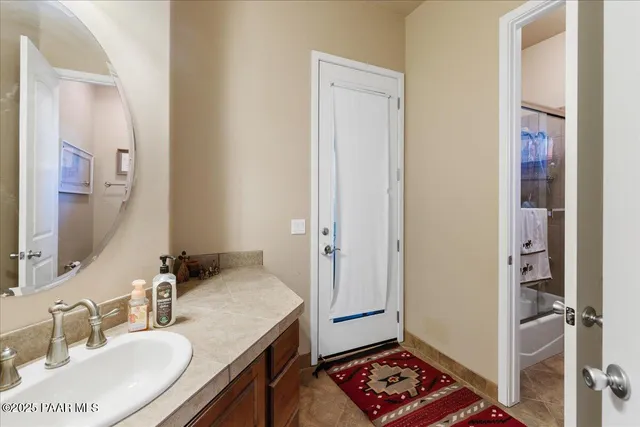 a bathroom with a sink and a mirror