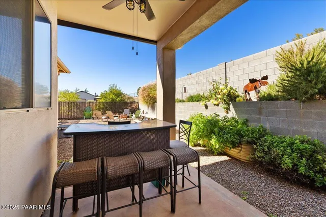 a view of a chairs and table in the patio
