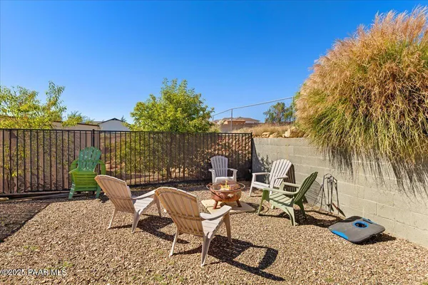 a view of a backyard with sitting area