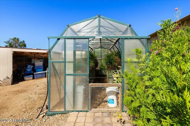 a glass door in front of a house
