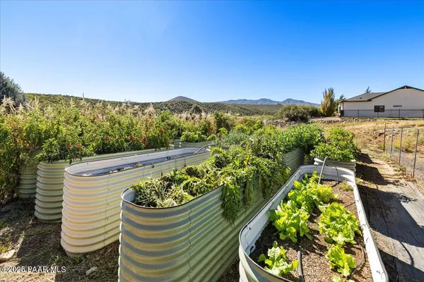a view of a swimming pool with a yard