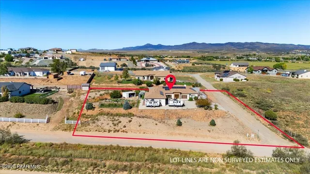 a view of a town with mountains in the background