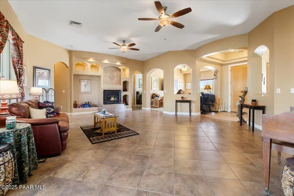 a living room with lots of furniture and view of a large window