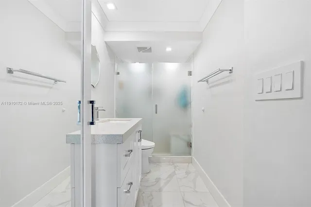 a bathroom with a sink and shower