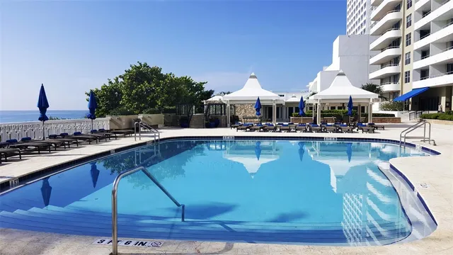 a view of swimming pool with a yard