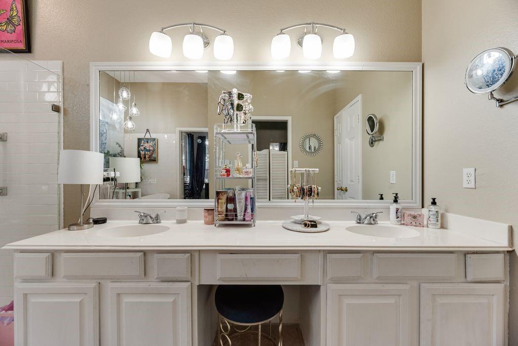 3205 Cape Cod Court Arlington, TX 76017 - Photo 23 of 30 a bathroom with a sink and a mirror