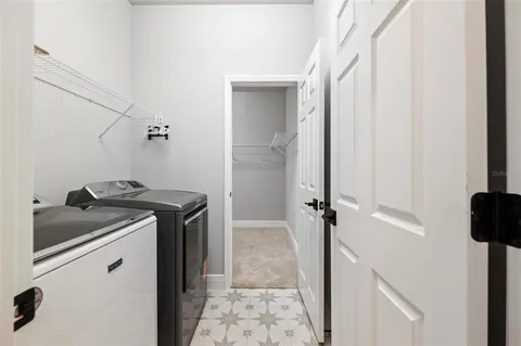 a bathroom with a granite countertop sink a vanity and a shower