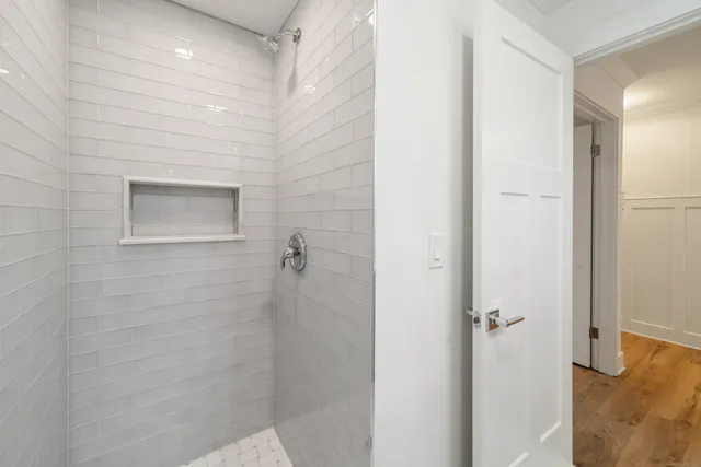 a bathroom with a shower and a sink