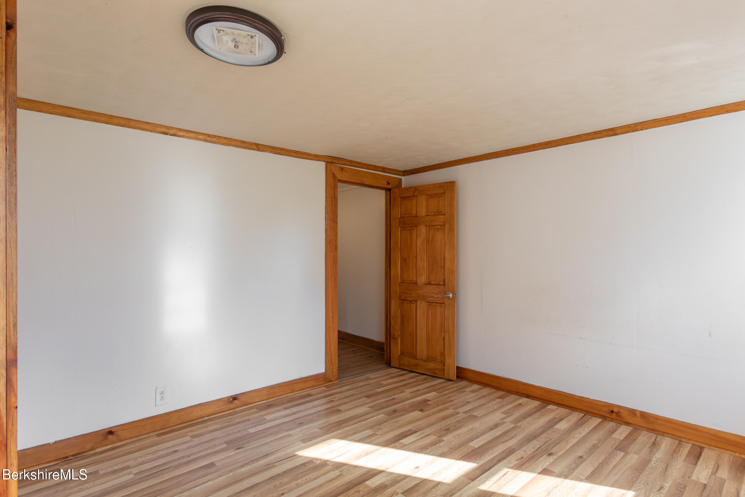 89-91 Pecks Road Pittsfield, MA 01201 - Photo 11 of 28 a view of an empty room with wooden floor