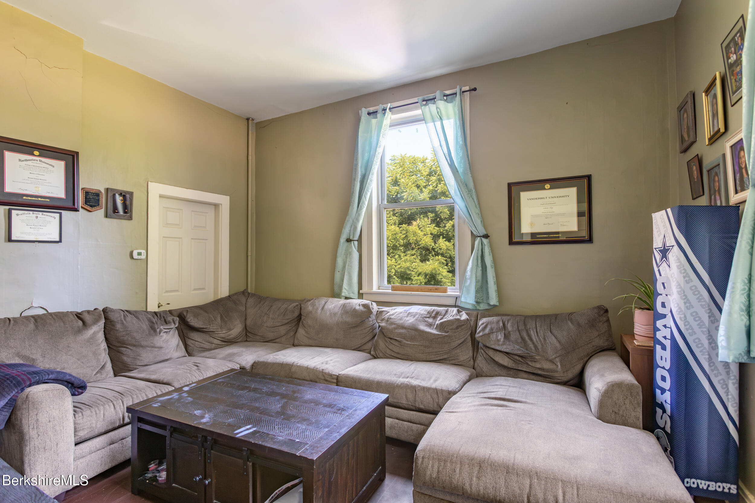 89-91 Pecks Road Pittsfield, MA 01201 - Photo 23 of 28 a living room with furniture and a window