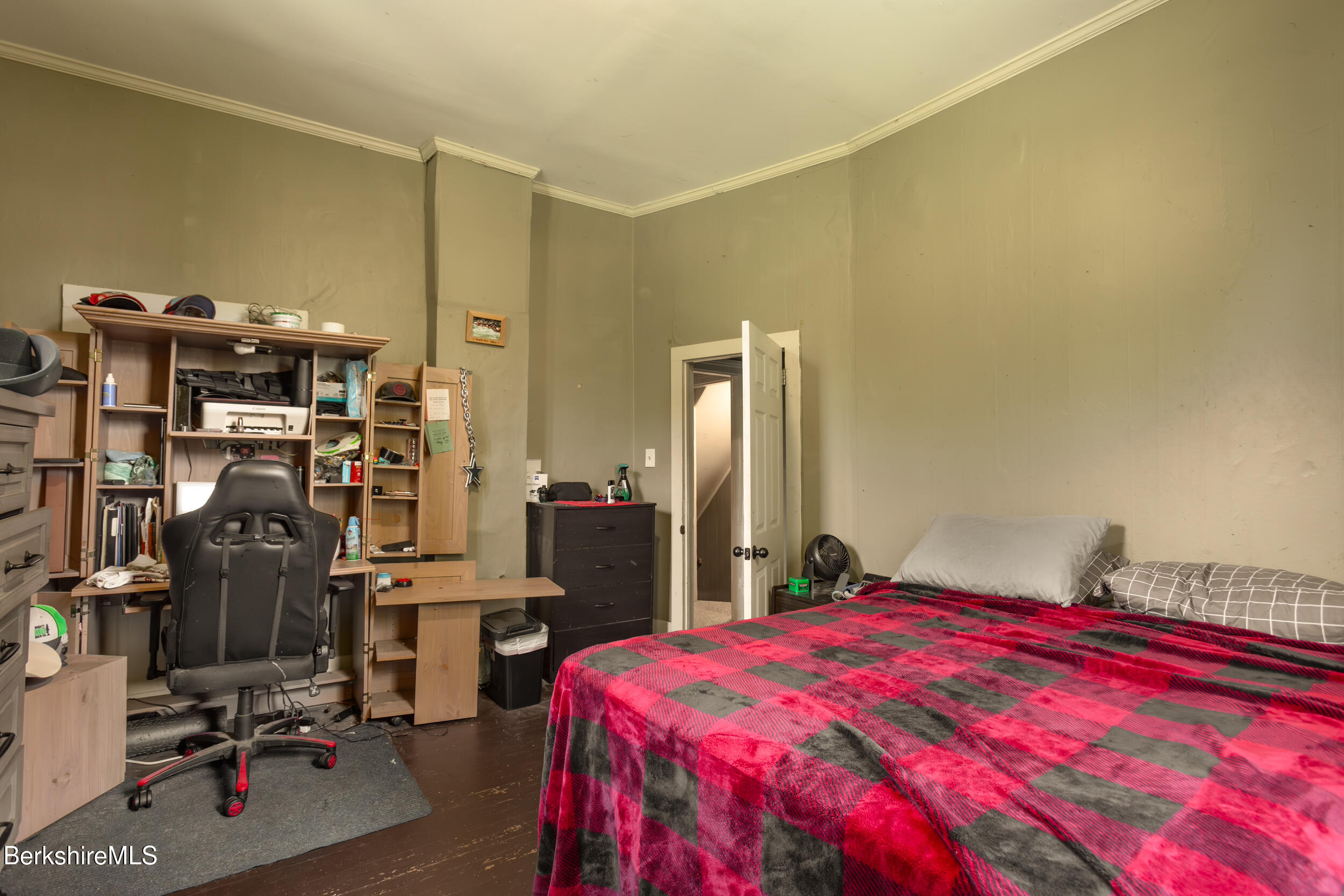 89-91 Pecks Road Pittsfield, MA 01201 - Photo 25 of 28 a bedroom with a bed and gym equipment