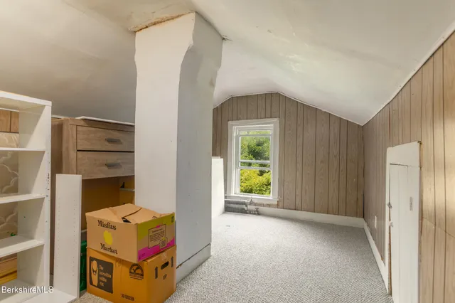 a room that has a bed and a closet in it