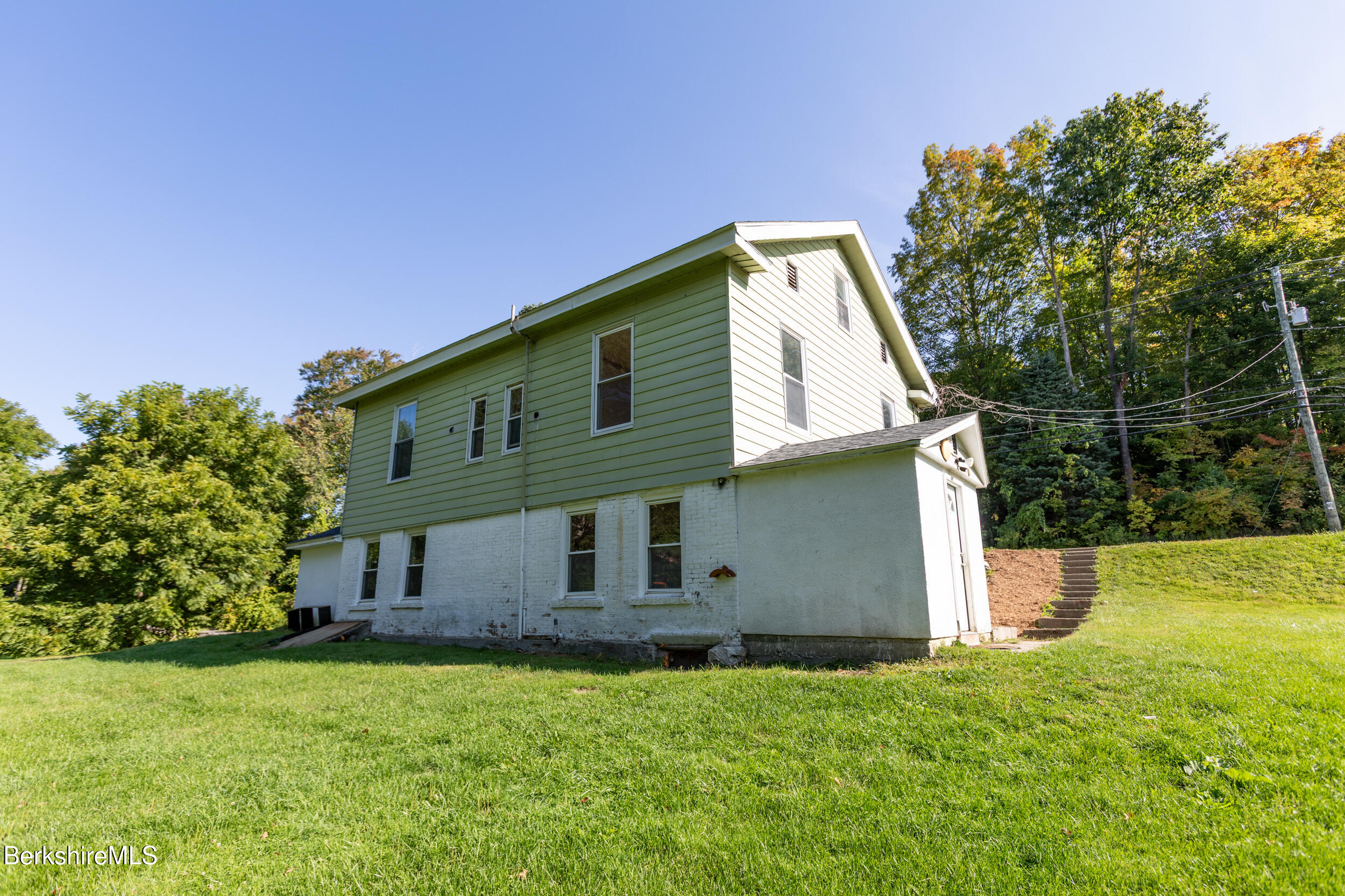 89-91 Pecks Road Pittsfield, MA 01201 - Photo 3 of 28 a front view of house with yard