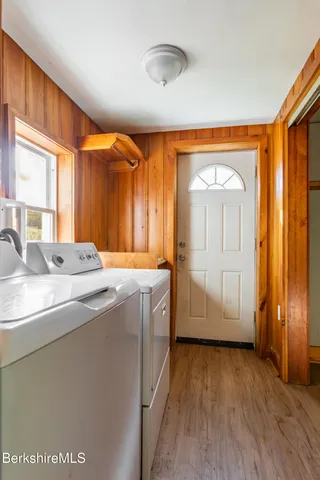 a spacious bathroom with a granite countertop sink and a mirror