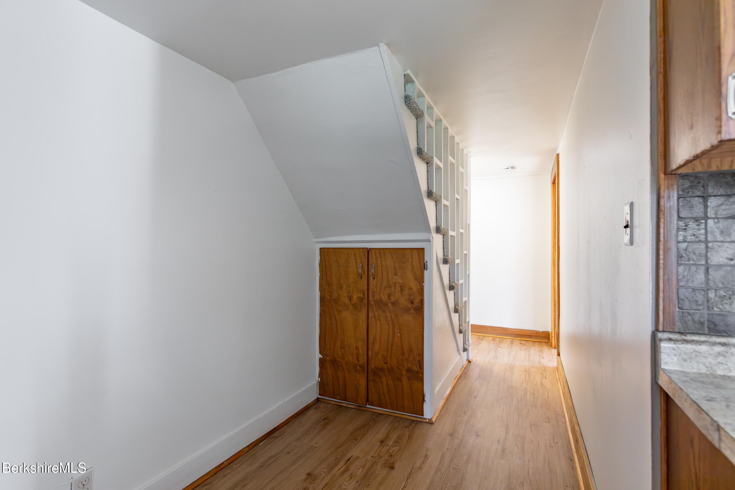 89-91 Pecks Road Pittsfield, MA 01201 - Photo 8 of 28 a view of hallway with wooden floor
