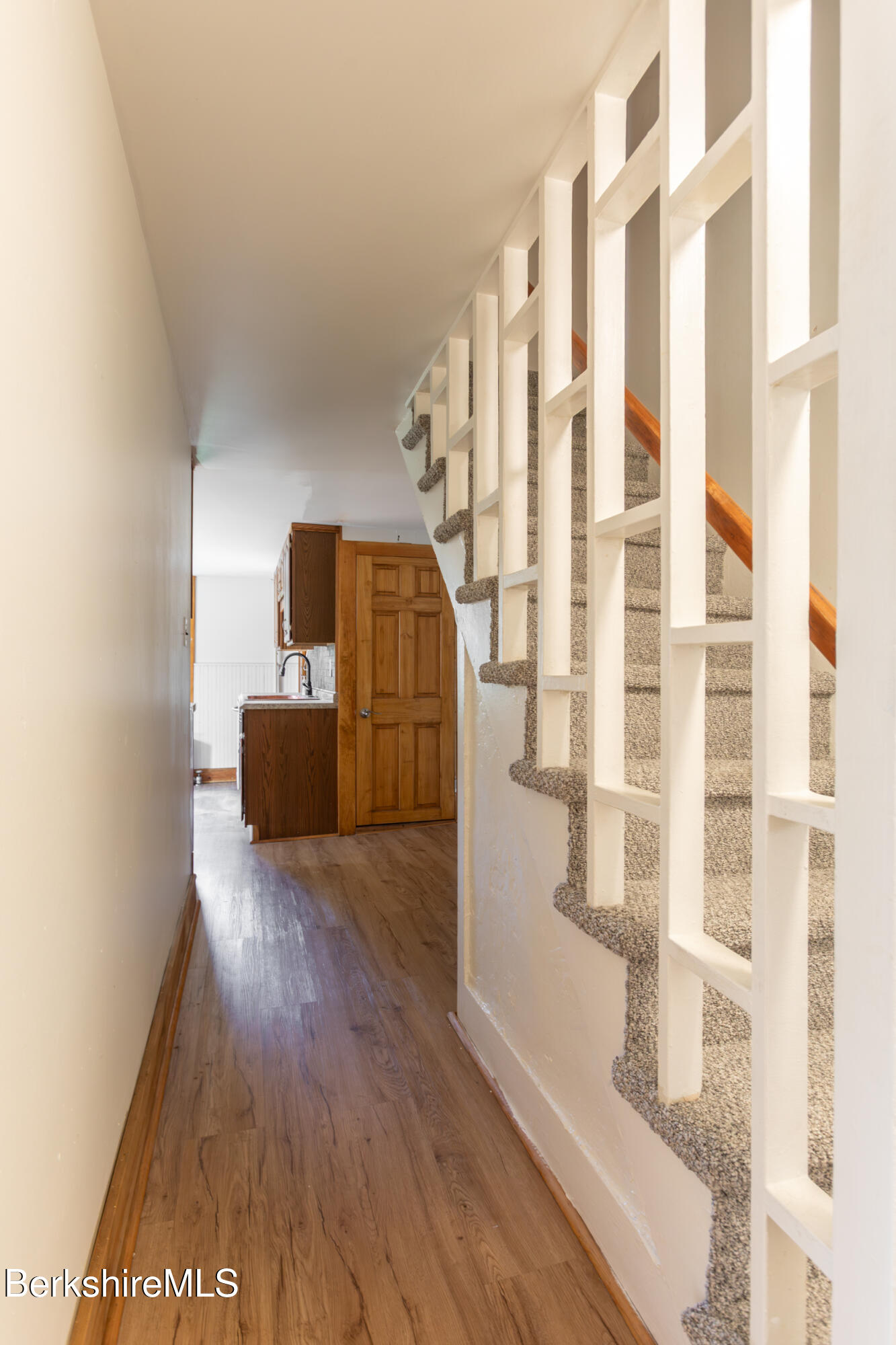 89-91 Pecks Road Pittsfield, MA 01201 - Photo 9 of 28 a view of front door with hallway and wooden floor
