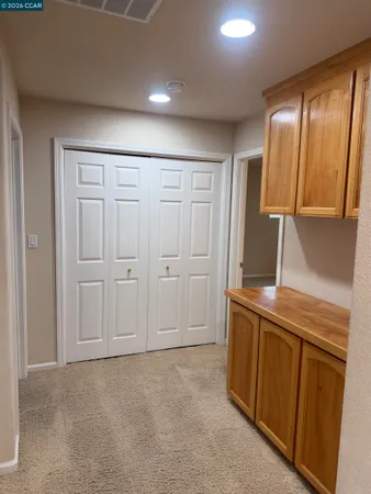 a view of a kitchen with cabinets