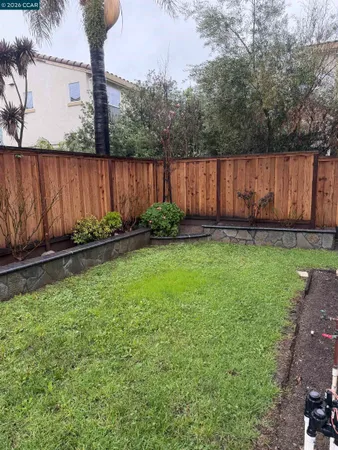 a backyard of a house with lots of green space