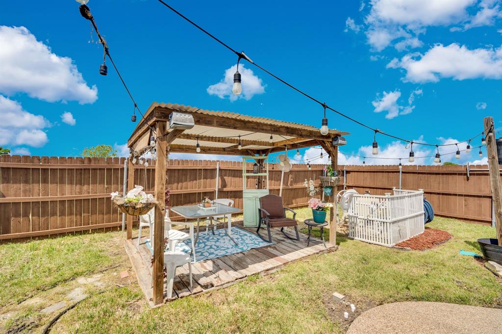430 Carter Road Italy, TX 76651 - Photo 9 of 36 a patio with table and chairs