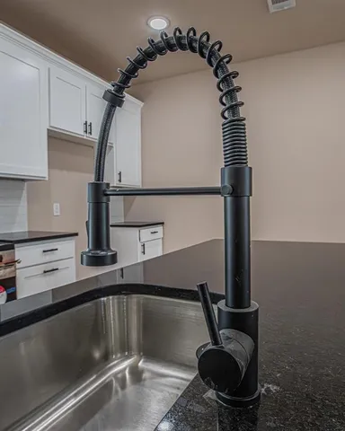 a kitchen with a sink and a stove