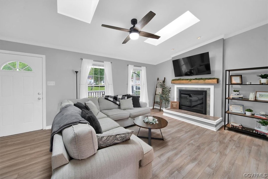7719 Drexelbrook Road Chesterfield, VA 23832 - Photo 12 of 49 a living room with furniture a flat screen tv and a fireplace