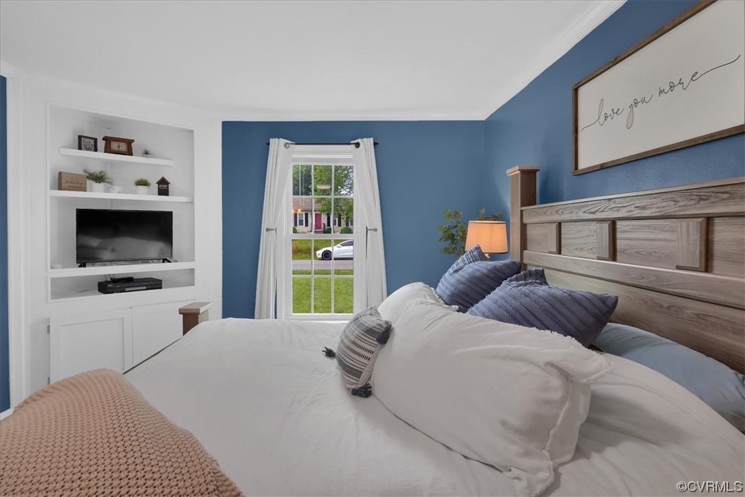 7719 Drexelbrook Road Chesterfield, VA 23832 - Photo 23 of 49 a bedroom with a bed and a tv