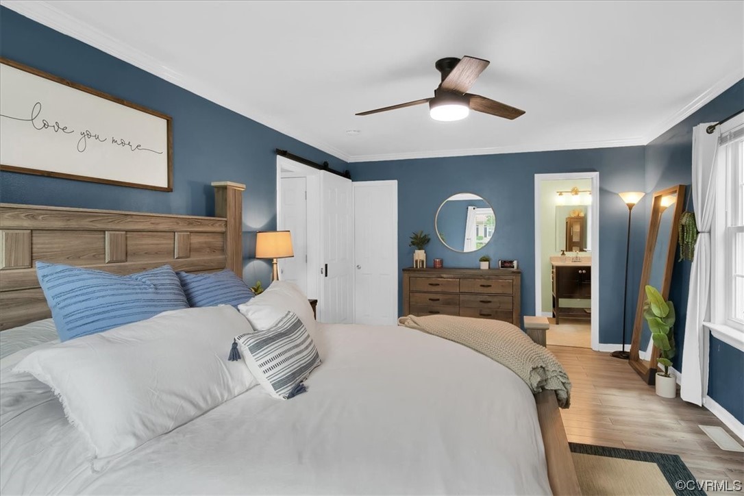 7719 Drexelbrook Road Chesterfield, VA 23832 - Photo 25 of 49 a bedroom with a large bed and a chandelier