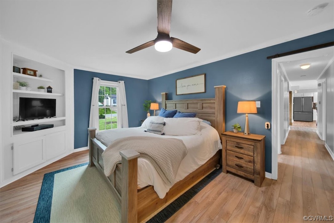 7719 Drexelbrook Road Chesterfield, VA 23832 - Photo 27 of 49 a bedroom with a bed and a flat screen tv