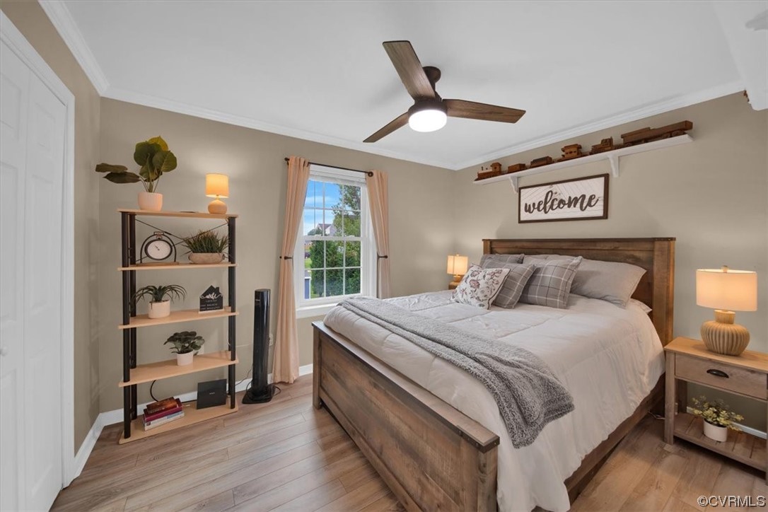 7719 Drexelbrook Road Chesterfield, VA 23832 - Photo 31 of 49 a bedroom with a large bed and a chandelier