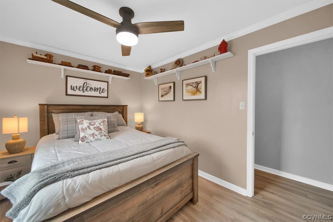 7719 Drexelbrook Road Chesterfield, VA 23832 - Photo 33 of 49 a bedroom with a large bed and a chandelier