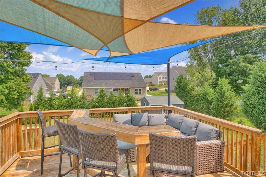 7719 Drexelbrook Road Chesterfield, VA 23832 - Photo 41 of 49 a view of balcony with furniture and umbrella