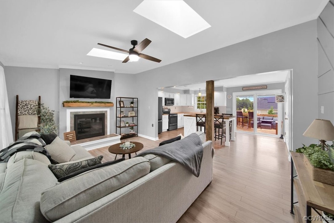 7719 Drexelbrook Road Chesterfield, VA 23832 - Photo 8 of 49 a living room with fireplace furniture and a flat screen tv