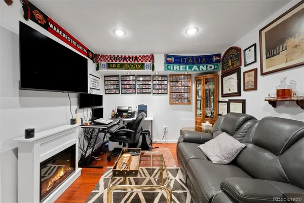 a view of a livingroom with workspace and a couch