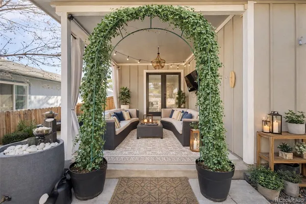 a view of a house with potted plants