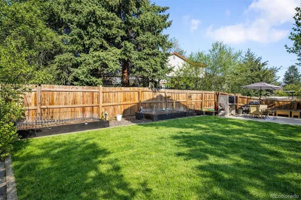 a view of backyard with seating and green space