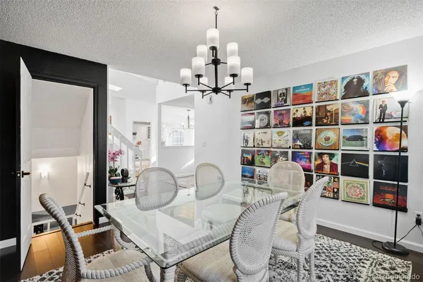 a room with furniture a rug and a chandelier
